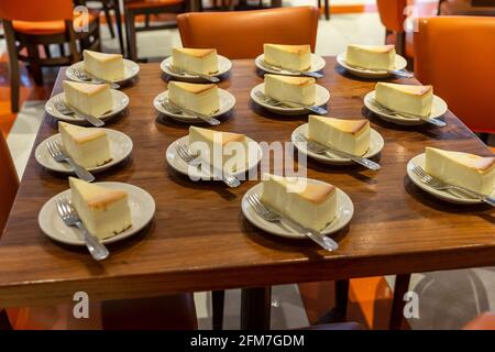 New York, NY - May 6, 2021: Pieces of cheesecake on display at U. S. Senator Charles Schumer marking re-opening of Junior’s Cheesecake restaurant on Times Square Stock Photo