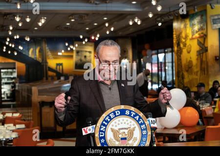 New York, United States. 06th May, 2021. U. S. Senator and Senate Majority Leader Charles Schumer marks re-opening of Junior's Cheesecake restaurant on Times Square in New York on May 6, 2021. He was instrumental to pass the relief to keep small businesses like restaurant open after devastation from COVID-19 pandemic. Senator ate piece of delicious cheesecake as well as having some breakfast. (Photo by Lev Radin/Sipa USA) Credit: Sipa USA/Alamy Live News Stock Photo