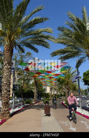 Walking along Sderot Ben Gurion in Tel-Aviv, Israel. Stock Photo