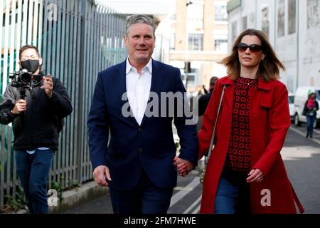 LONDON, May 7, 2021 Britain's Labour Party leader Keir Starmer and his wife Victoria Starmer leave a polling station after voting in local elections in London, Britain, on May 6, 2021. Millions of voters in Britain are going to polling stations for local elections in what political commentators have dubbed as the Super Thursday, which is seen as a major test for Britain's main political party leaders. Credit: Xinhua/Alamy Live News