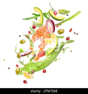 Flying ingredients for healthy salad with salmon on white background Stock Photo