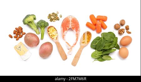 Healthy products with pills on white background Stock Photo