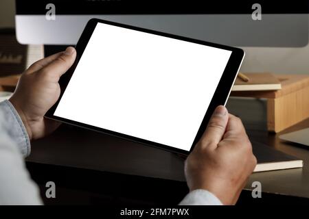 man holding blank screen tablet design  Close up of ipad mock up tablet computer Stock Photo