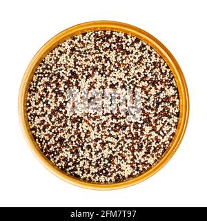 top view of mix of quinoa seeds in round ceramic bowl cutout on white background Stock Photo