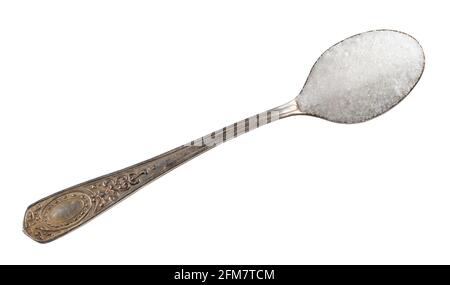 top view of refined white sugar from sugar beet in silver teaspoon cutout on white background Stock Photo