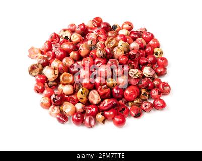 pile of pink peppercorns (Baie rose) closeup on white background Stock Photo