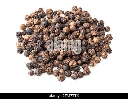handful of black pepper peppercorns closeup on white background Stock Photo
