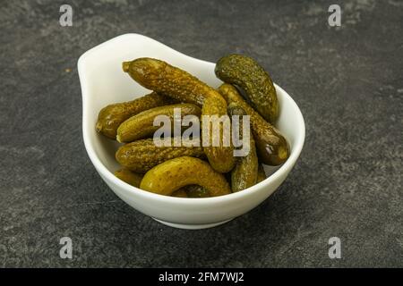 Pickled young gherkin in the bowl Stock Photo