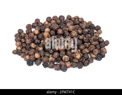 pile of hainan black pepper closeup on white background Stock Photo