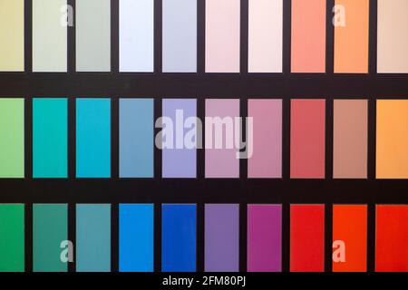 Paint color swatches in the background interior design studio. Selection Various colors and shades of paint for interior design and decoration works. High quality photo Stock Photo