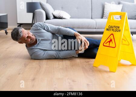 Slip Fall Accident. Floor Sign Caution And Safety Stock Photo