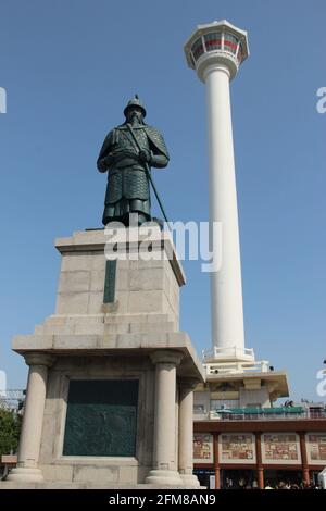 Statue of Admiral Yi Sun-Sin and the Busan Tower in Yongdu-san Park in Busan, South Korea Stock Photo