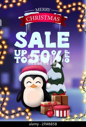 Christmas discount banner with garland and penguin in Santa Claus hat with presents. Vertical discount banner with winter landscape on the background Stock Photo