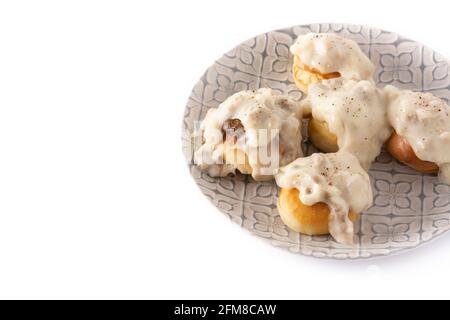 Traditional American biscuits and gravy for breakfast isolated on white background Stock Photo