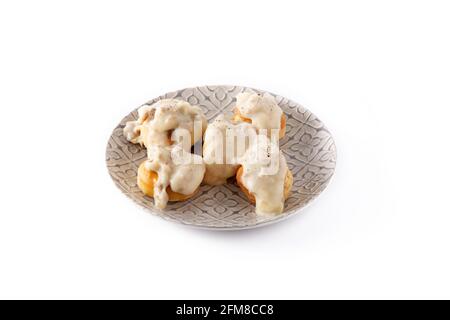 Traditional American biscuits and gravy for breakfast isolated on white background Stock Photo