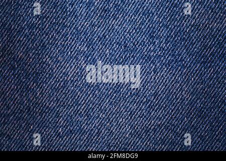 Texture denim. Cloth rough, worn, with small defects, slight darkening at the corners. Realistic fabric pattern for all purposes Stock Photo