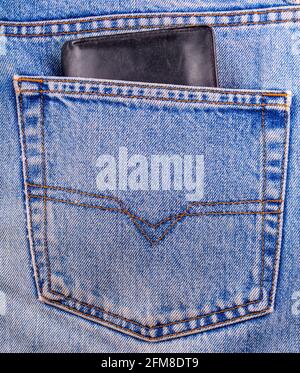 old black Wallet showing in back pocket of jeans Stock Photo