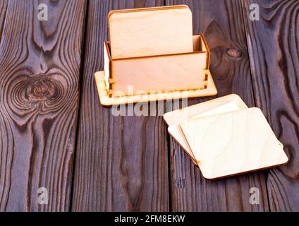 Set of wooden stands for hot cups on wooden table Stock Photo