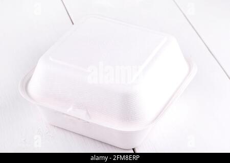 White food box, packaging for hamburger, lunch, fast food, burger, sandwich. Product pack on white wooden table Stock Photo