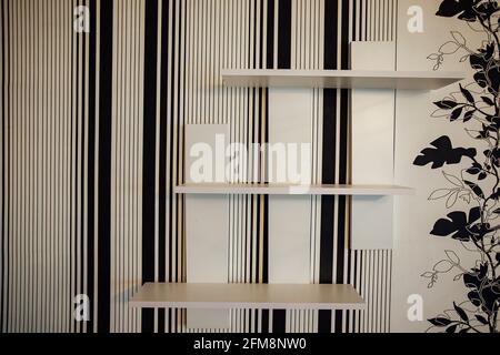 a room in a cheap hotel. minimalistic interior of an economy class hotel room. overnight stay for the traveler. several beds and a table Stock Photo