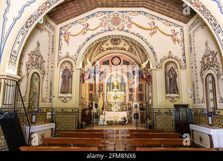 Alajar, Huelva, Spain - May 1, 2021: Main altar of Hermitage of Our Lady of the Angels from the 16th century in the Peña de Arias Montano (Rock of Ari Stock Photo