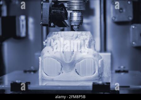 3D printer prints the form of molten plastic white. Stock Photo
