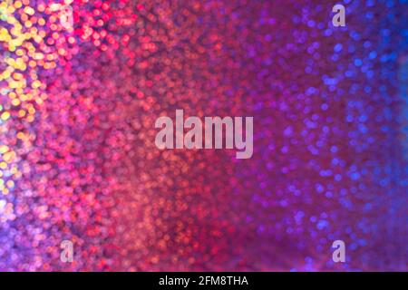 A rainbow sparkle background with colourful bokeh. Multi-colored disco background Stock Photo