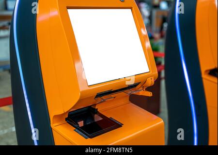 mockup Self service machine and help desk kiosk. airport self check-in device with blank white screen. Technology and smart application to confirm fli Stock Photo