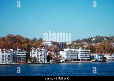 Coast of  Bosphorus, Istanbul. A bright sunny day, drowning in the greenery of the birch, sea, small houses on the shore Stock Photo