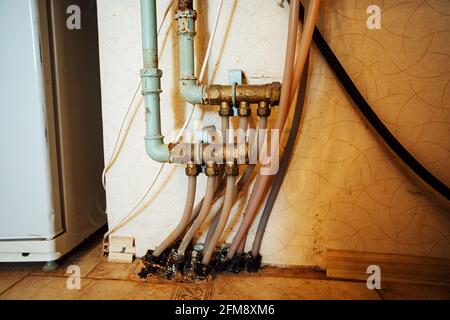 a room in a cheap hotel. minimalistic interior of an economy class hotel room. overnight stay for the traveler. several beds and a table Stock Photo