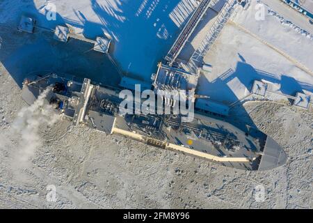 Sabetta, Tyumen region, Russia - March 30, 2021: The Vladimir Vize gas carrier is loaded with liquefied natural gas at the berth.