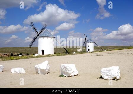 Windmills by the road and stones on the way Stock Photo