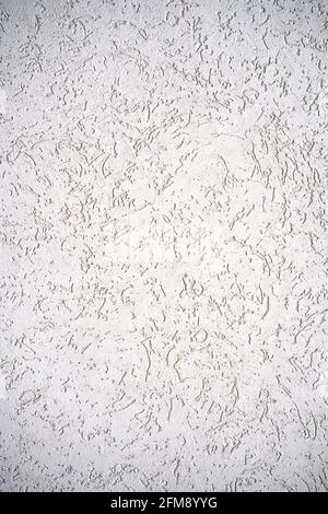 The texture of the plaster is bark beetle on the wall. Seamless grey texture. Stock Photo