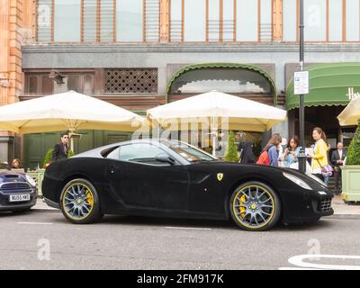 LONDON, UK - CIRCA AUGUST 2013: A Ferrari 599 GTB Fiorano with a black velvet wrap. Stock Photo