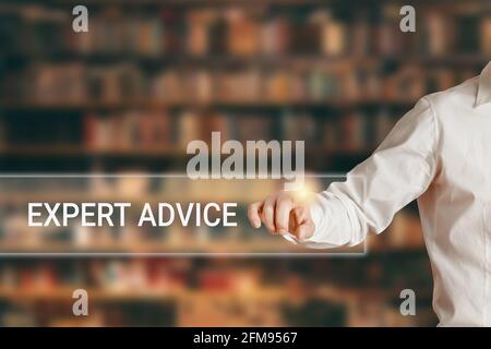 Male hand pressing the word expert advice on a virtual search display bar. Online expert advice concept. Stock Photo