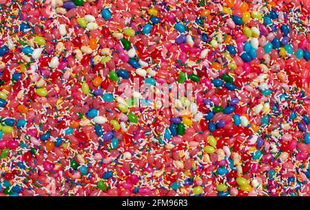 jelly beans jellybean candy and sprinkles food background with various covers and flavors Stock Photo