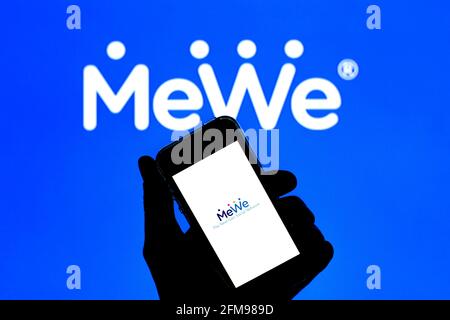 In this photo illustration a MeWe app seen displayed on a smartphone with  the MeWe logo in the background. (Photo by Thiago Prudencio / SOPA  Images/Sipa USA Stock Photo - Alamy