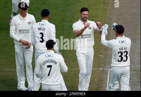 Manchester, UK. May 7th 2021:  County Championship Cricket, Lancashire versus Glamorgan, Day 2; James Anderson of Lancashire celebrates with team mates after taking the wicket of Glamorgan's Billy Root to leave Glamorgan on 121-4 Credit: Action Plus Sports Images/Alamy Live News Stock Photo