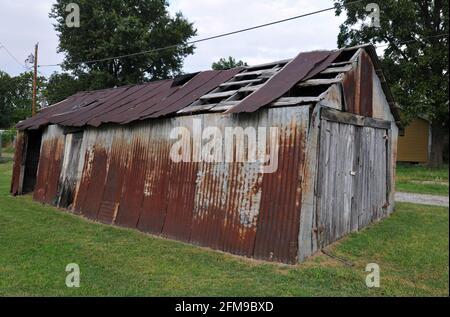 The rusting old barn at baseball great Mickey Mantle's boyhood home in Commerce, Oklahoma. Mantle used the shed as a backstop as he practiced. Stock Photo