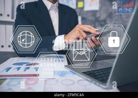 Protection network security computer data and safe   financial stability Businessman pressing key keyword protect to protect digital business finance Stock Photo