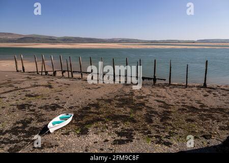Small boat on sand at Aberdyfi on the welsh coast Stock Photo