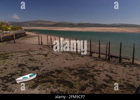 Small boat on sand at Aberdyfi on the welsh coast Stock Photo
