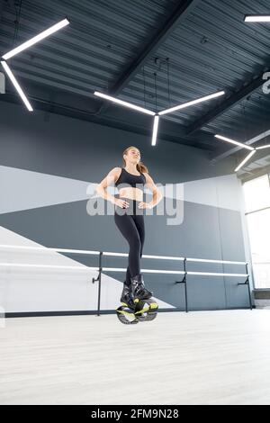 Young female wearing a tight sportswear with splash patterns Stock