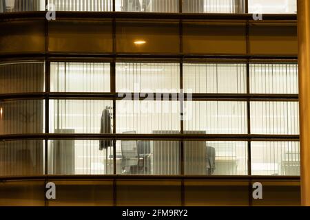 Lights on in empty city office, offices. Stock Photo