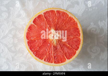 Overhead View of a a Sliced Pink Grapefruit Stock Photo