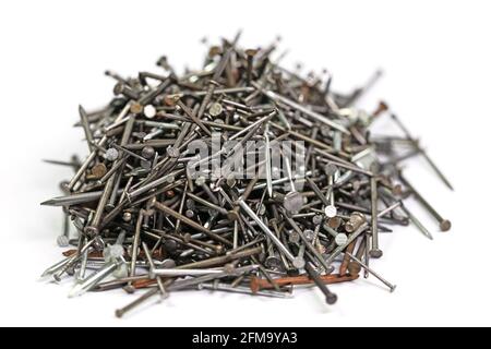 Many different nails against a white background Stock Photo