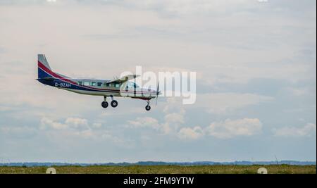 cessan 208b grand caravan light aircraft returning to land after dropping parachute jumpers Stock Photo