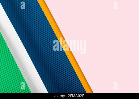 Colored corrugated paper texture. Geometric shapes and lines. Minimalist background. Flat lay. Copy space. Stock Photo