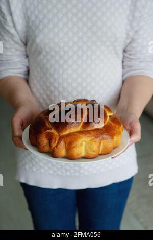 Woman holding chocolate cake in beautiful hands Stock Photo