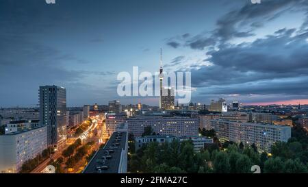 View of the illuminated streets of Berlin with the TV tower and Alexanderplatz at night. Stock Photo